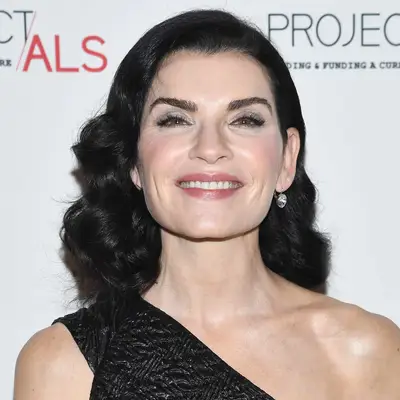 Julianna Margulies wears a shoulder-length haircut with old Hollywood curls