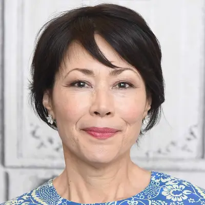 Ann Curry wears a bixie short hairstyle with side-swept bangs