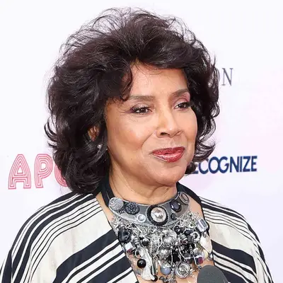 Phylicia Rashad wears a voluminous short curly hairstyle