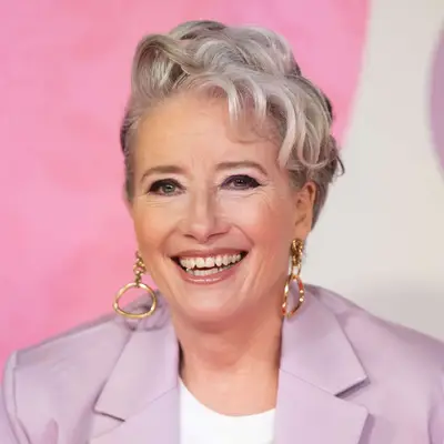 Emma Thompson wears a pixie haircut with subtle layered curls