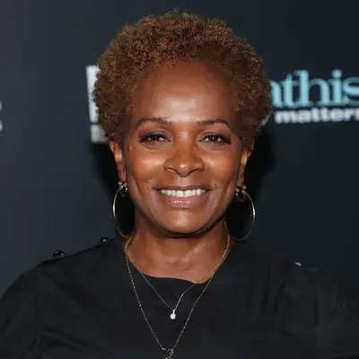Vanessa Bell Calloway wears a short curly afro hairstyle