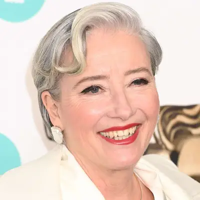 Emma Thompson wears a short hairstyle with face-framing bangs