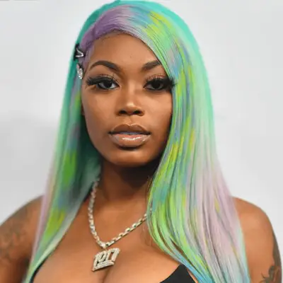 Rapper Asian Doll wearing pastel rainbow hair
