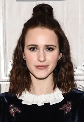 Rachel Brosnahan with half-up topknot bun