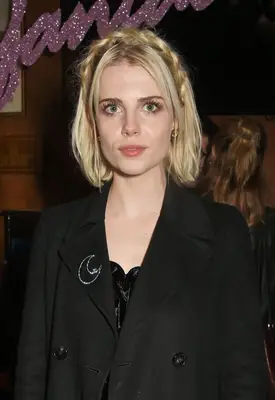 Lucy Boynton with short braided hair