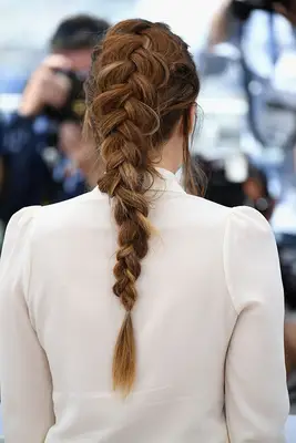 Riley Keough with a Dutch braid from the back angle