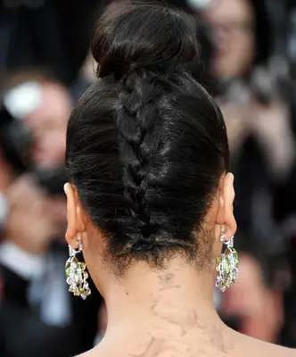 La La Anthony with a braided top knot bun on the red carpet