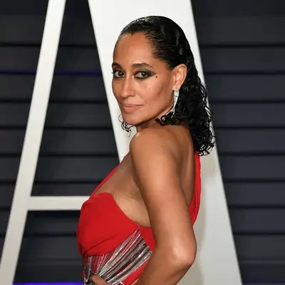 Tracee Ellis Ross with wet slicked back curly hair on the red carpet