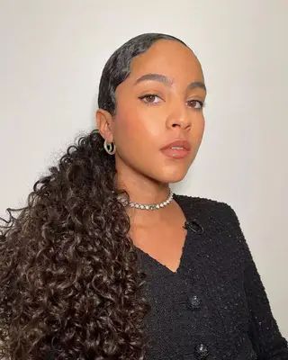 Person with a low curly ponytail