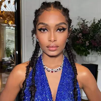Yara Shahidi wearing braids with swooped edges