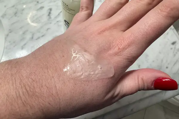 The color and texture of SEEN Skin-Caring Fragrance-Free Shampoo seen on the back of a person