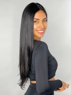 woman smiliing with straight black hairstyle