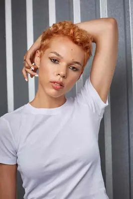 woman with peach pixie cut