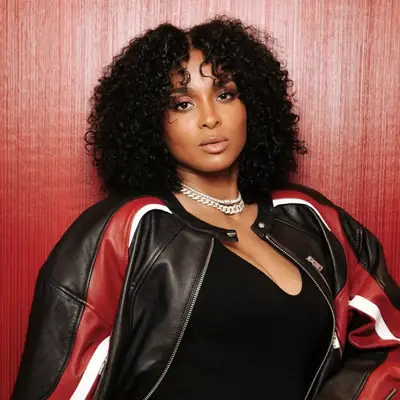 Ciara with curly bangs and lob