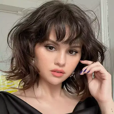 Selena Gomez wearing straight across bangs