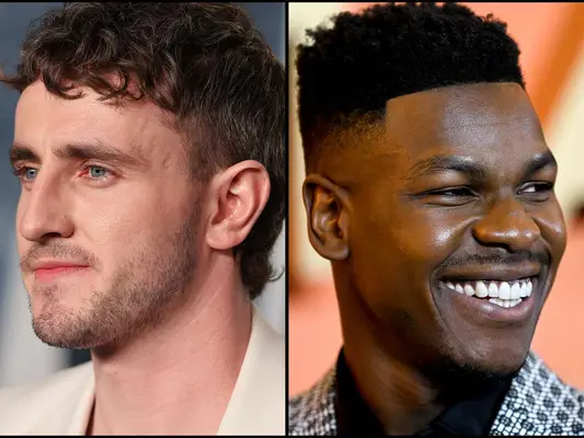 Close up of actors Paul Mescal (left) and John Boyega (right) with fade haircuts