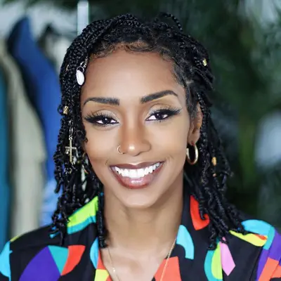 Hair influencer Brittany Williams wears mini braids with charms