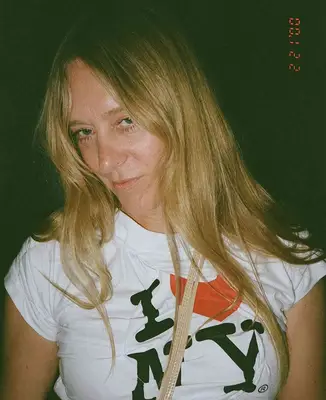 Chloe Sevingy wearing a white t shirt