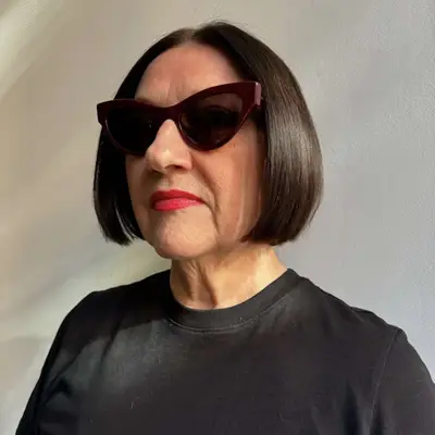 Woman with short bob hairstyle and cat-eye sunglasses