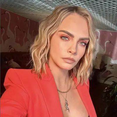 Cara Delevingne with a wavy short bob hairstyle