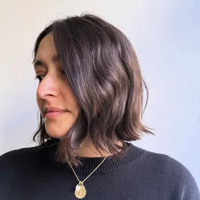 Woman with a wavy longer bob hairstyle
