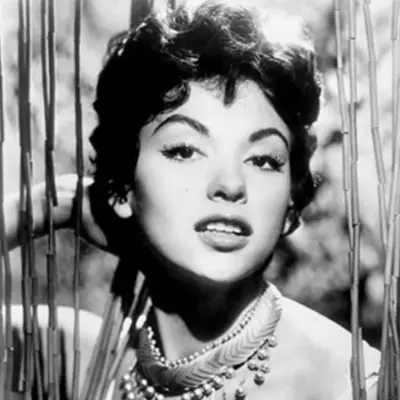 Rita Moreno wears a short shag haircut in the 1960s