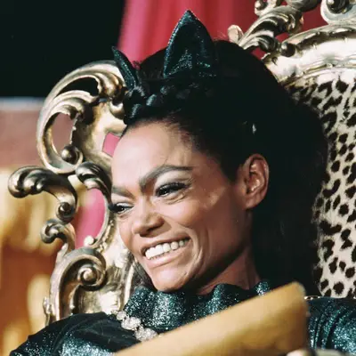 Eartha Kitt wears a high ponytail hairstyle with cat ears as Catwoman in 1968