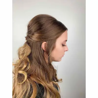 Person wears a half-up subtle beehive hairstyle