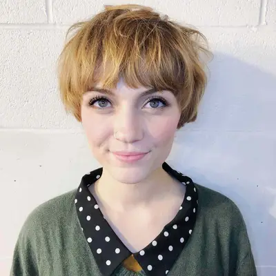 Person with a messy bowl haircut