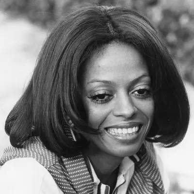 Diana Ross wears a sleek bob hairstyle with center part