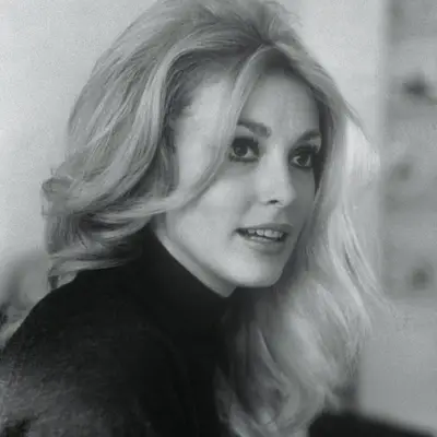 Sharon Tate wears curled, voluminous blonde hair in 1966