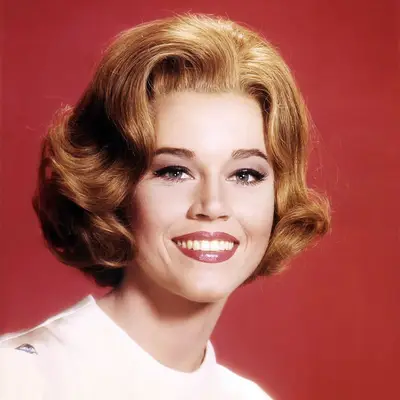 Jane Fonda wears a strawberry blonde curled bob hairstyle in 1962