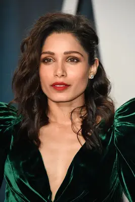 Freida Pinto side flip with textured waves and pinned side