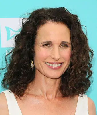Andie MacDowell with a curly shoulder-length style