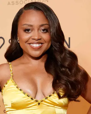 Quinta Brunson with long cascading waves 