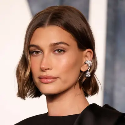 Hailey Bieber with side-parted chin-length lob at the Vanity Fair Oscar Party