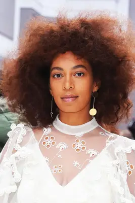 Solange with brushed out curly hair 