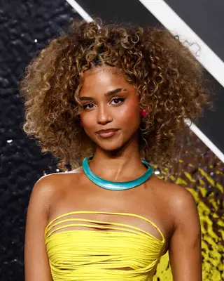 Tyla with half-up curly hairstyle 