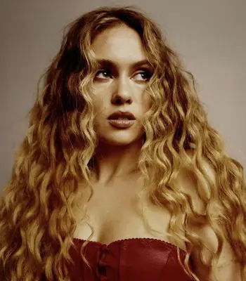 Sasha Keable with long layered haircut