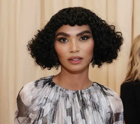 Sophia Roe at the Met gala with a curly, angular bob and micro bangs sitting high above the neck line