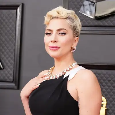 Lady Gaga with creamy blonde hair in an updo