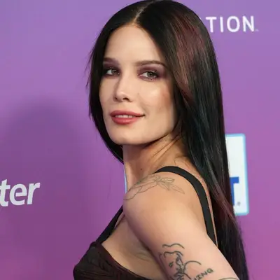 Halsey wears dark hair with pops of copper to complement her hazel eyes