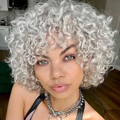 A woman with a gray lob and full bangs