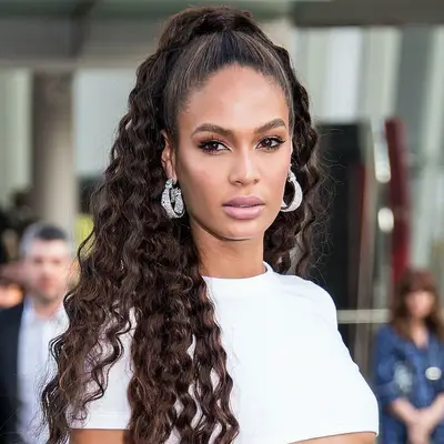 Joan Smalls with a curly half high ponytail at the 2018 CFDA Fashion Awards in New York City
