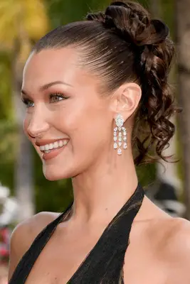 Bella Hadid wearing a sleek updo with curls