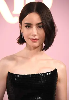Lily Collins wearing a middle part bob