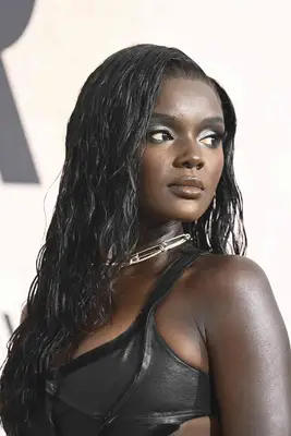 Model Duckie Thot wearing her hair in a wet, wavy style