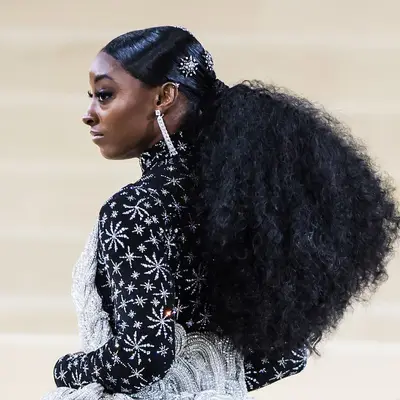 Simone Biles wearing a long, bushy ponytail hairstyle
