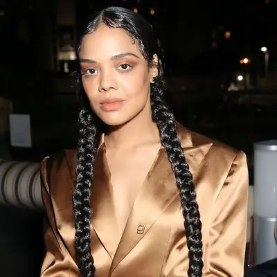 Tessa Thompson wearing a two braid hairstyle with slicked edges