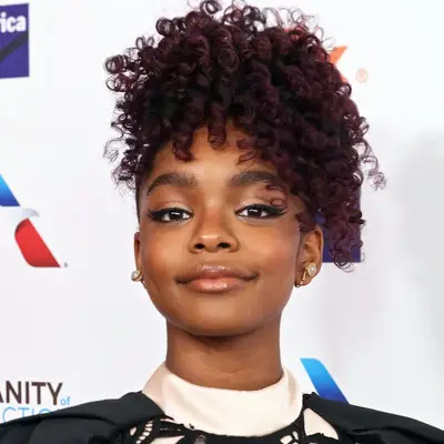 Marsai Martin wearing a curly, pinapple hairstyle